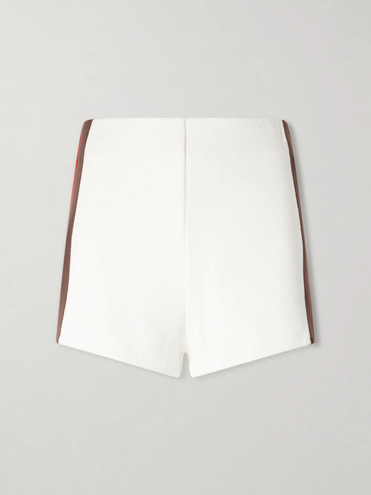 Image of a model wearing Shorts. Product name - Debora Striped Knitted Shorts in White colour by brand - Haight