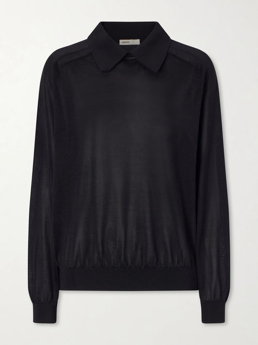 Image of a model wearing Outerwear. Product name - Alexa Silk-knitted Polo Sweater in Black colour by brand - KHAITE