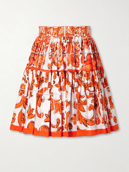 Image of a model wearing Skirts. Product name - Printed Cotton-poplin Mini Skirt in Orange colour by brand - Dolce & Gabbana