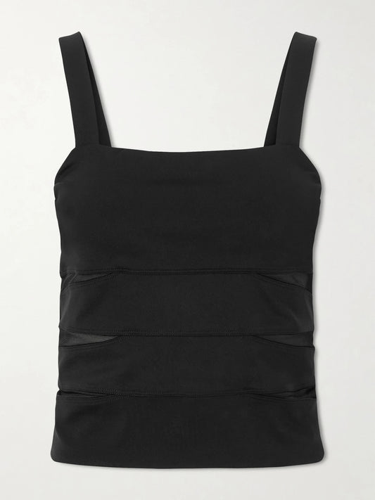 Image of a model wearing Tops. Product name - Morgan Mesh-paneled Stretch-jersey Tank in Black colour by brand - Eres