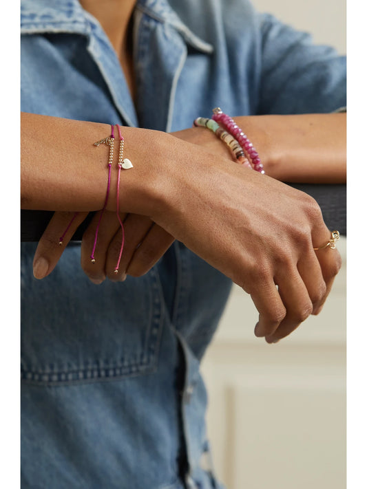 Image of Bracelets. Product name - Pure Heart 14-karat Gold Cord Bracelet in Fuchsia colour by brand - Sydney Evan