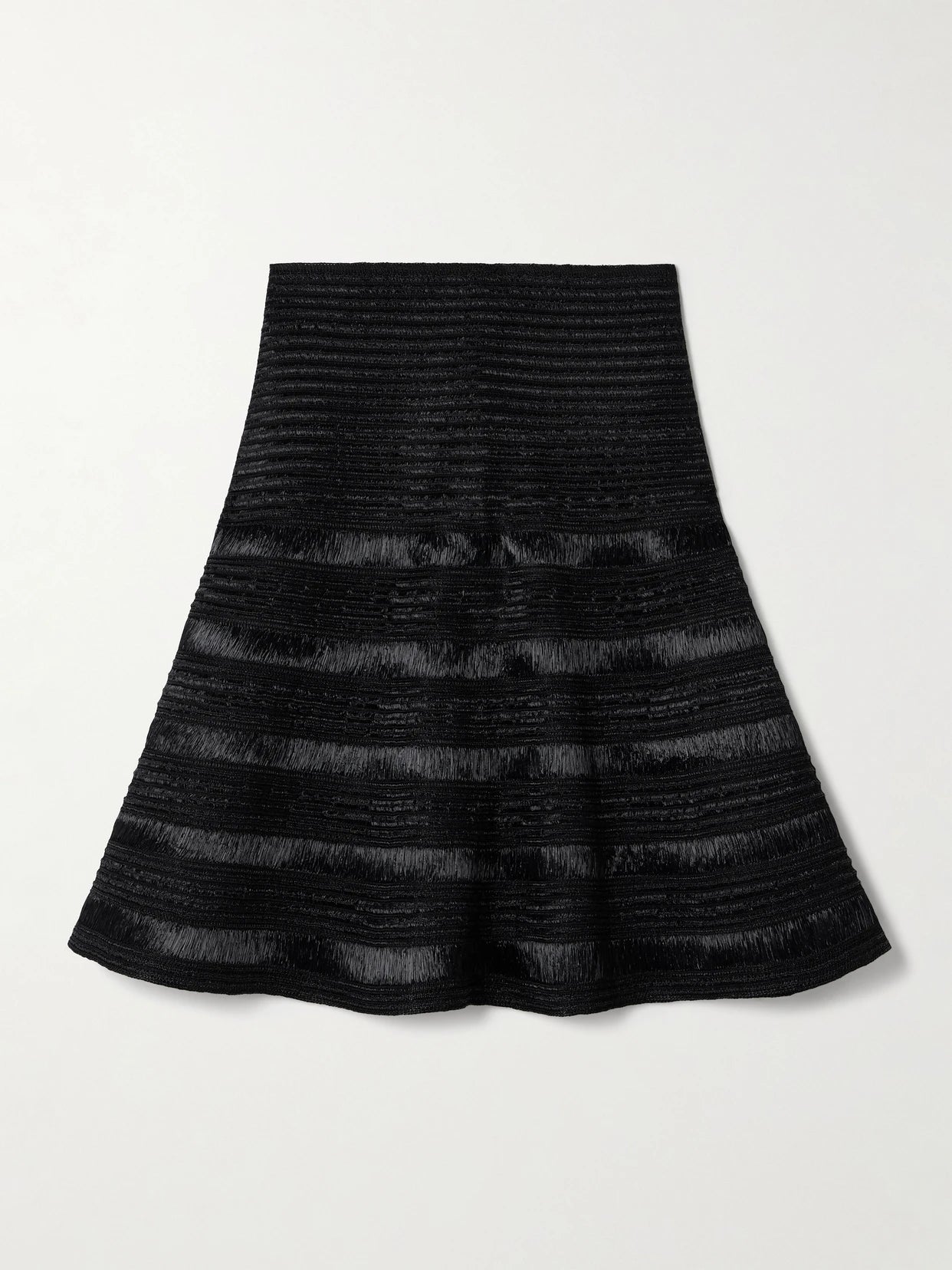 Image of a model wearing Skirts. Product name - Ribbed-knit Mini Skirt in Black colour by brand - Alaïa