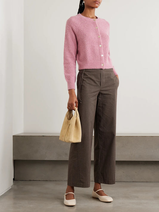 Image of a model wearing Outerwear. Product name - Petra Knitted Cardigan in Pink colour by brand - DÔEN