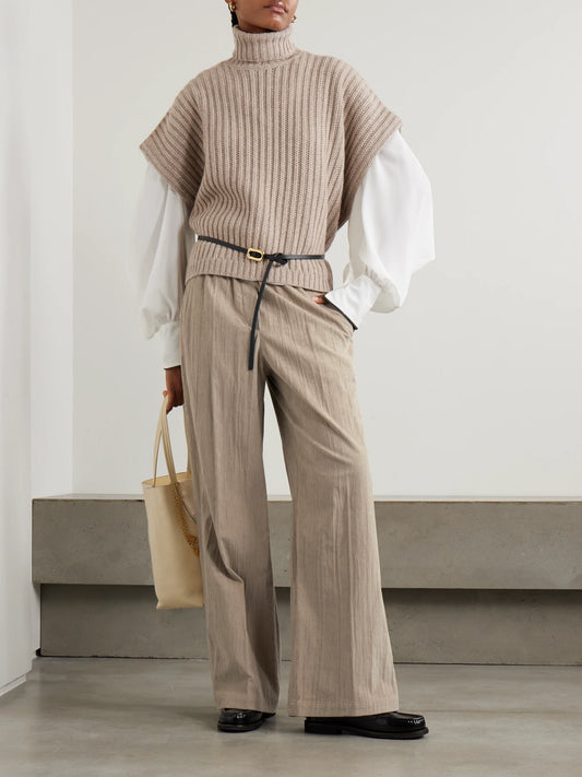 Image of a model wearing Outerwear. Product name - Ribbed Cashmere Turtleneck Sweater in Brown colour by brand - Brunello Cucinelli
