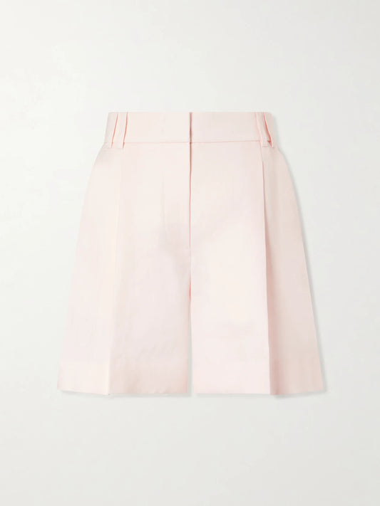 Image of a model wearing Shorts. Product name - Pleated Linen Shorts in Pastel pink colour by brand - Another Tomorrow