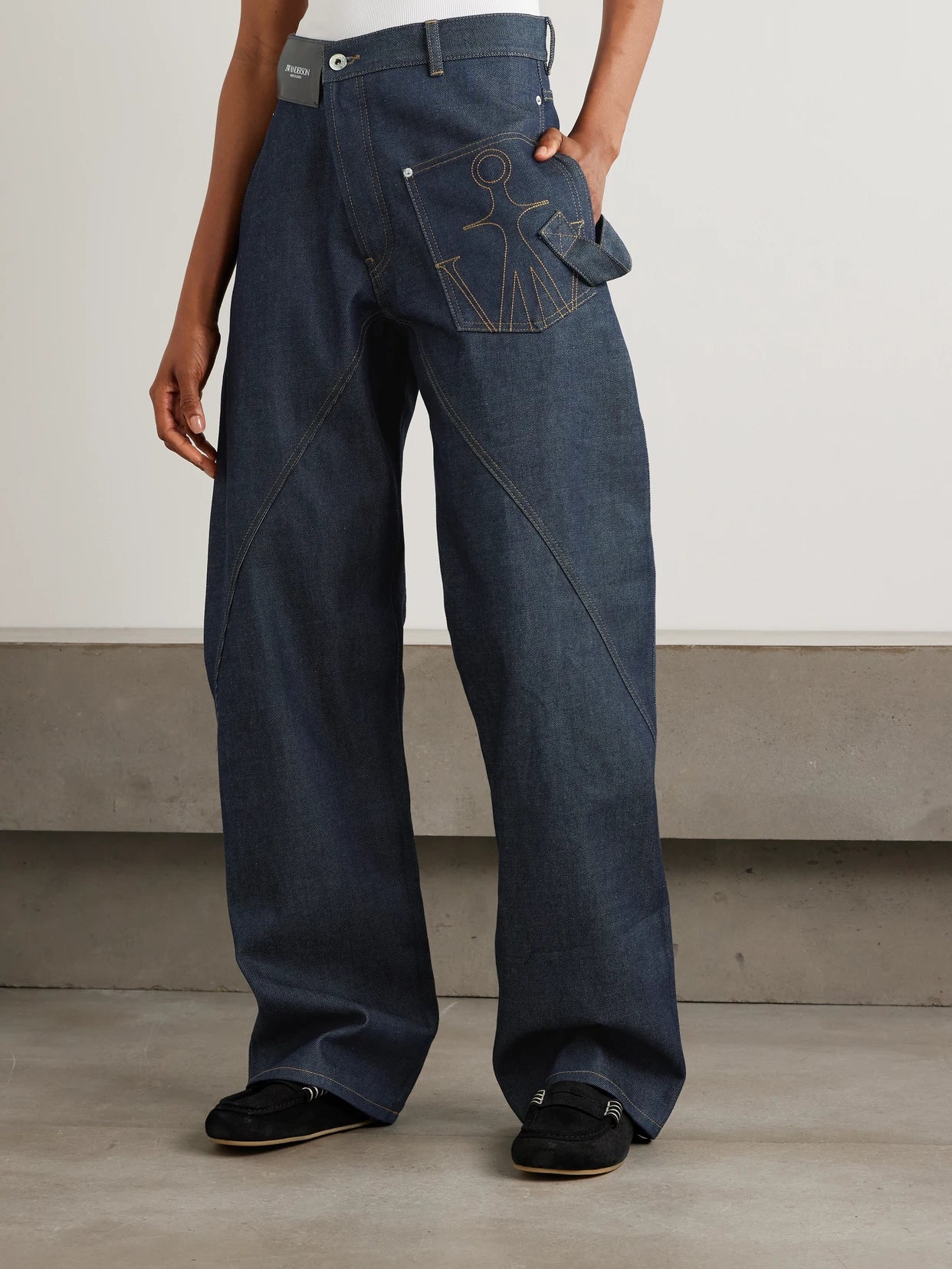 Twisted Asymmetric Embroidered High-rise Jeans