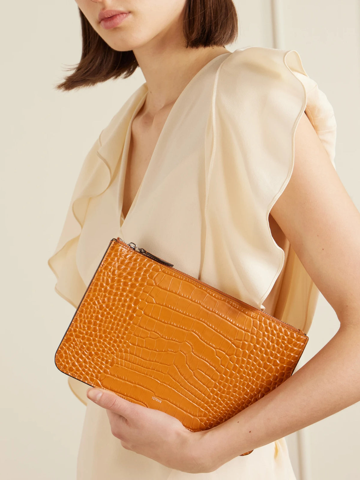 Image of Bags. Product name - Threefold Croc-effect Leather Clutch in Orange colour by brand - TOTEME