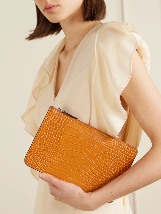 Image of Bags. Product name - Threefold Croc-effect Leather Clutch in Orange colour by brand - TOTEME