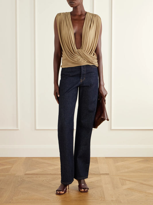 Image of a model wearing Tops. Product name - Ripple Draped Mesh Top in Beige colour by brand - Christopher Esber