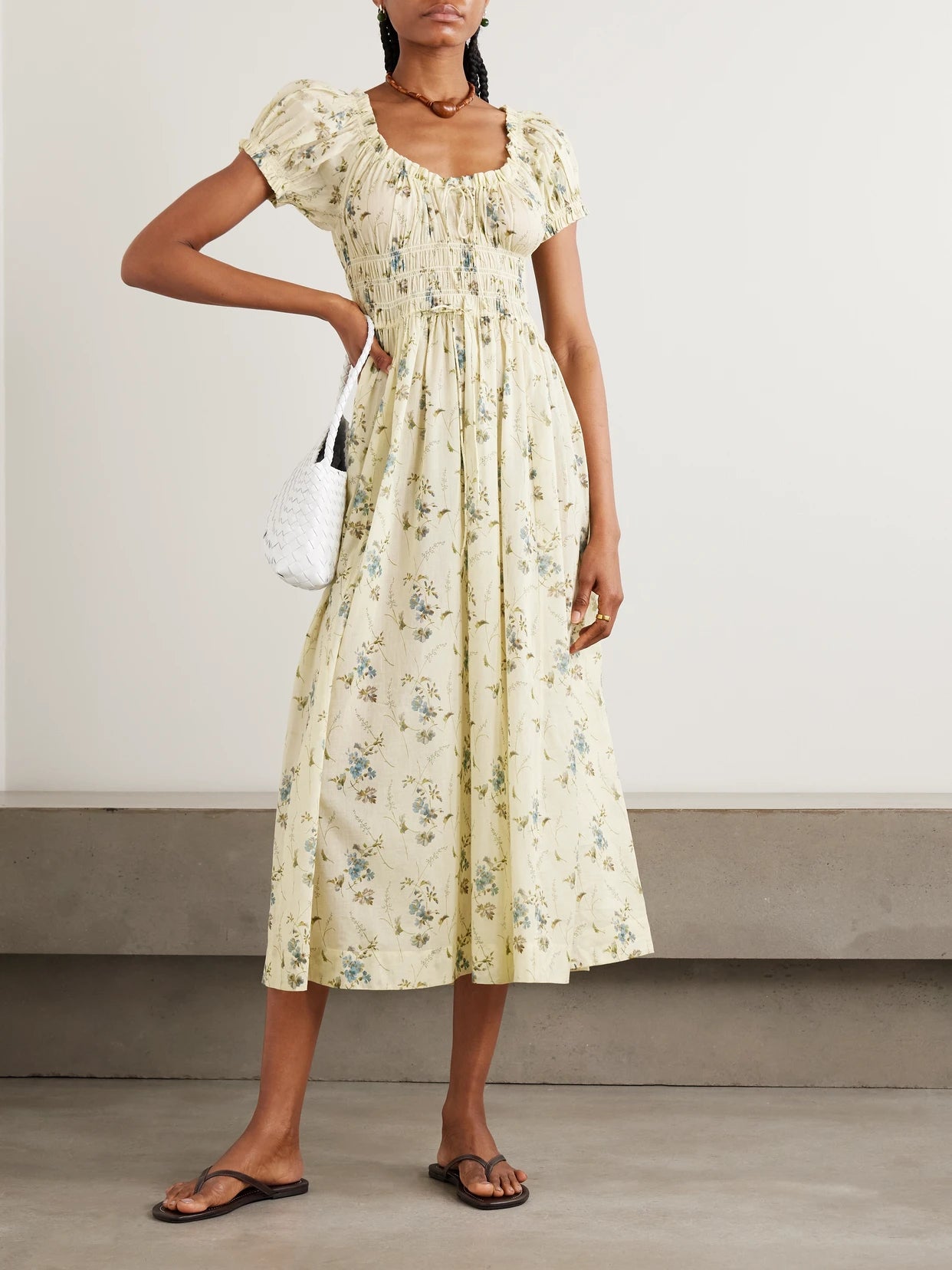 Image of Dresses. Product name - Ashlynn Tie-detailed Shirred Floral-print Organic Cotton-voile Midi Dress in Pastel yellow colour by brand - DÔEN