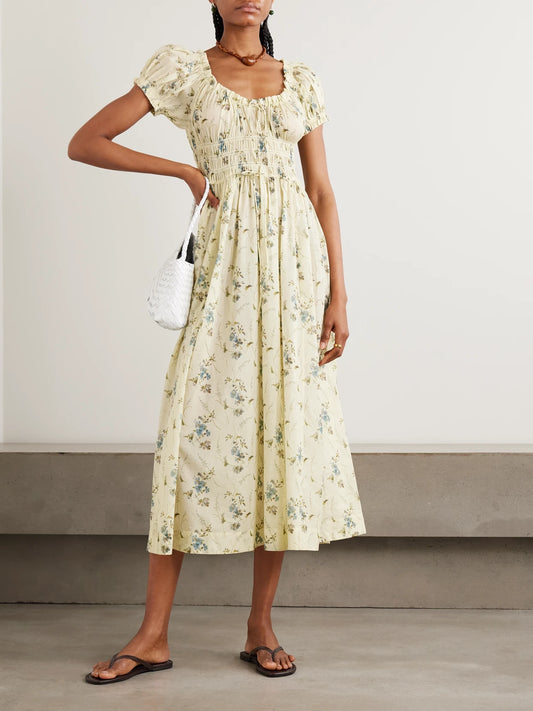 Image of Dresses. Product name - Ashlynn Tie-detailed Shirred Floral-print Organic Cotton-voile Midi Dress in Pastel yellow colour by brand - DÔEN