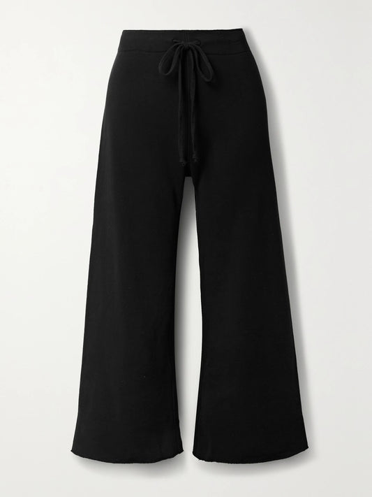 Image of Sleepwear & Loungewear. Product name - Kiki Cropped Voile-trimmed Cotton-jersey Track Pants in Black colour by brand - Nili Lotan