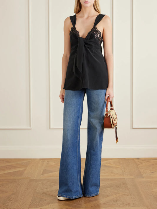 Image of a model wearing Tops. Product name - Knotted Lace-trimmed Silk Crepe De Chine Tank in Black colour by brand - Chloé