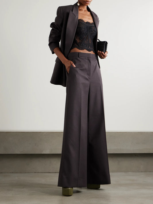Image of a model wearing Tops. Product name - Grosgrain-trimmed Lace Bustier Top in Black colour by brand - Dolce & Gabbana