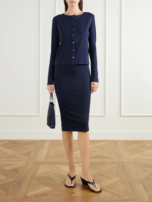 Image of a model wearing Skirts. Product name - Sheryl Pyratex Power 3 Stretch-jersey Midi Skirt in Navy colour by brand - THE PARK