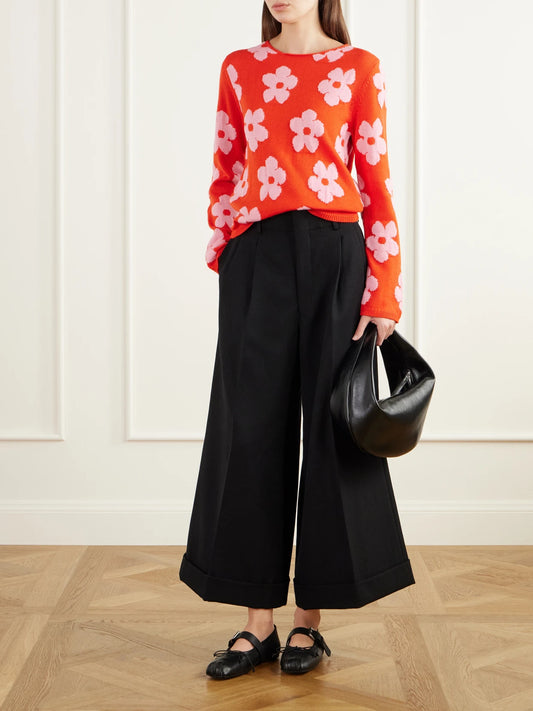 Image of a model wearing Outerwear. Product name - Floral-intarsia Sweater in Red colour by brand - Comme des Garçons GIRL