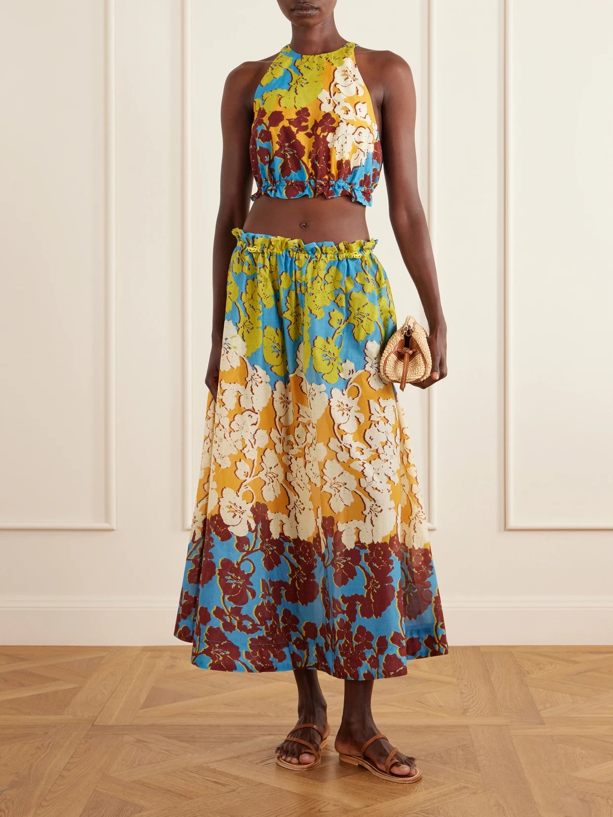Image of a model wearing Tops. Product name - Splice Cropped Floral-print Cotton And Silk-blend Top in Multi colour by brand - ALÉMAIS