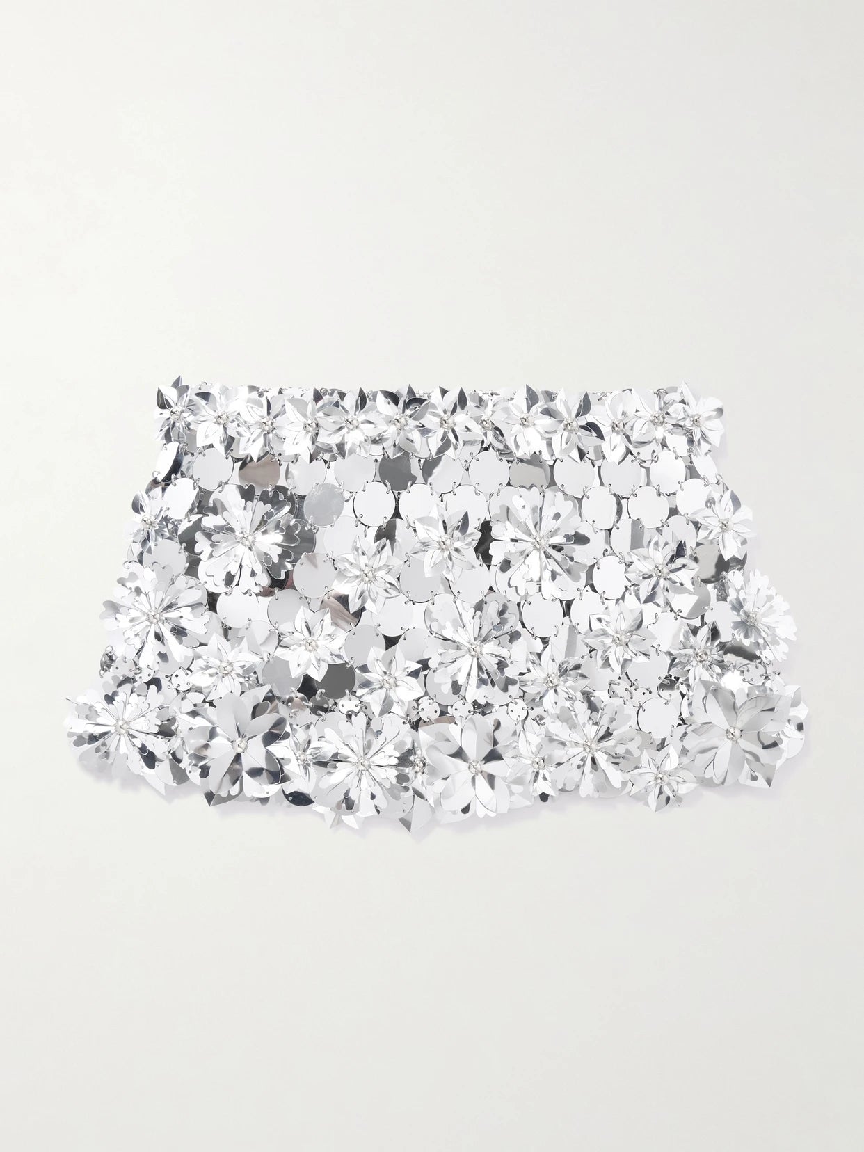 Image of a model wearing Skirts. Product name - Embellished Chainmail Mini Skirt in Silver colour by brand - RABANNE
