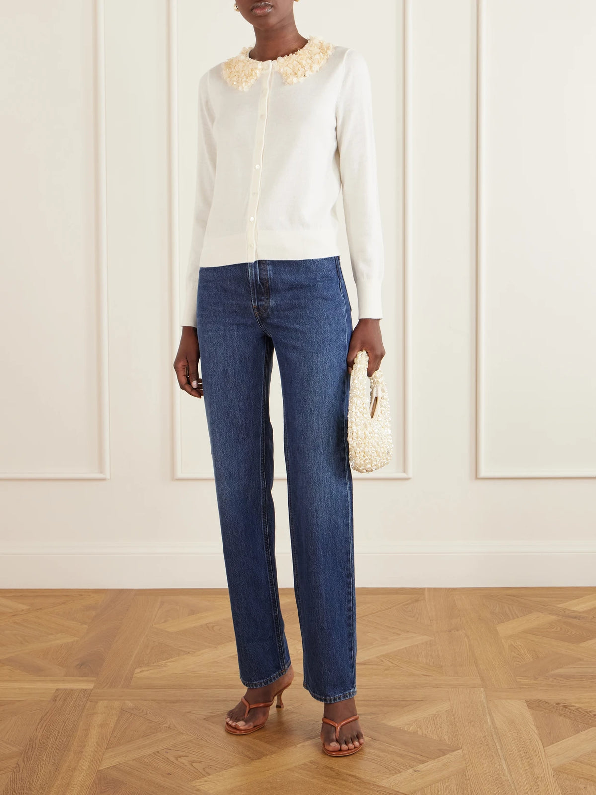 Image of a model wearing Outerwear. Product name - Anna Embellished Merino Wool Cardigan in Ivory colour by brand - Ulla Johnson