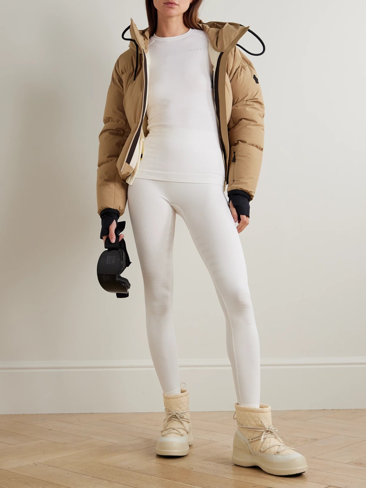 Image of a model wearing Tops. Product name - Maximum Warm Recycled-jersey Base Layer in White colour by brand - FALKE Ergonomic Sport System