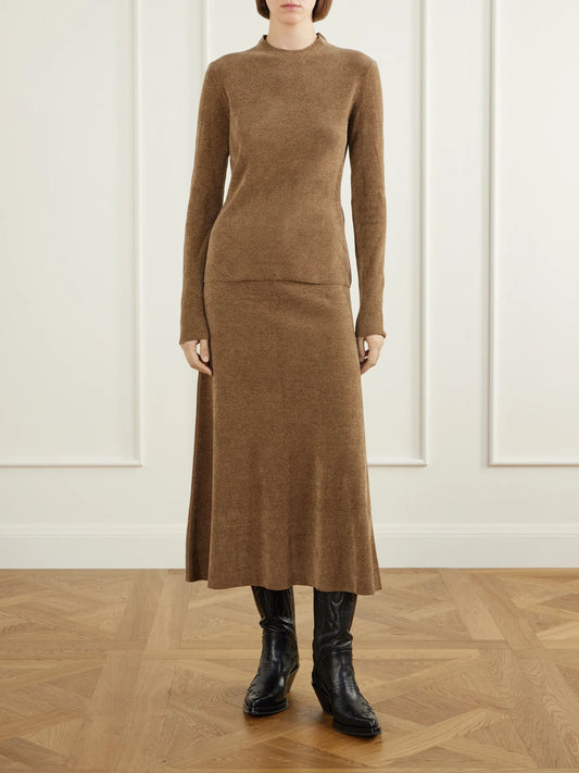 Image of a model wearing Skirts. Product name - Muir Ribbed Silk Midi Skirt in Camel colour by brand - Gabriela Hearst