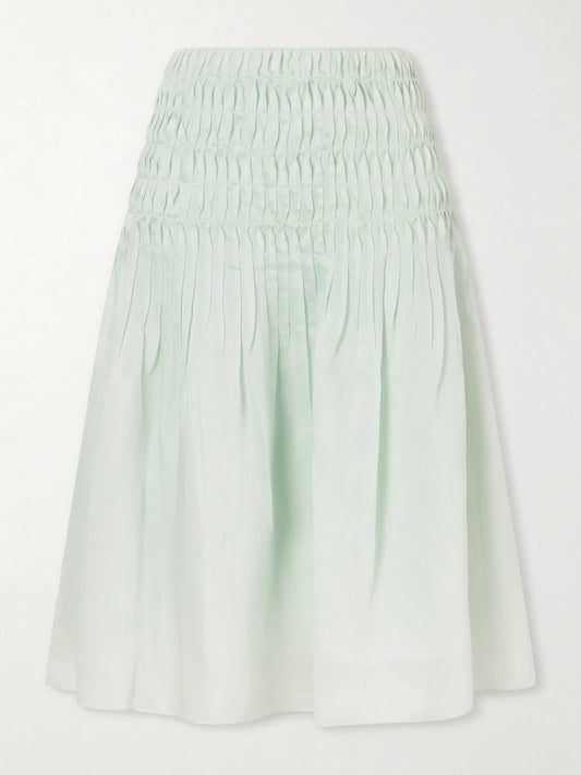 Image of a model wearing Skirts. Product name - Florence Ruched Lyocell And Silk-blend Skirt in Lime green colour by brand - KHAITE