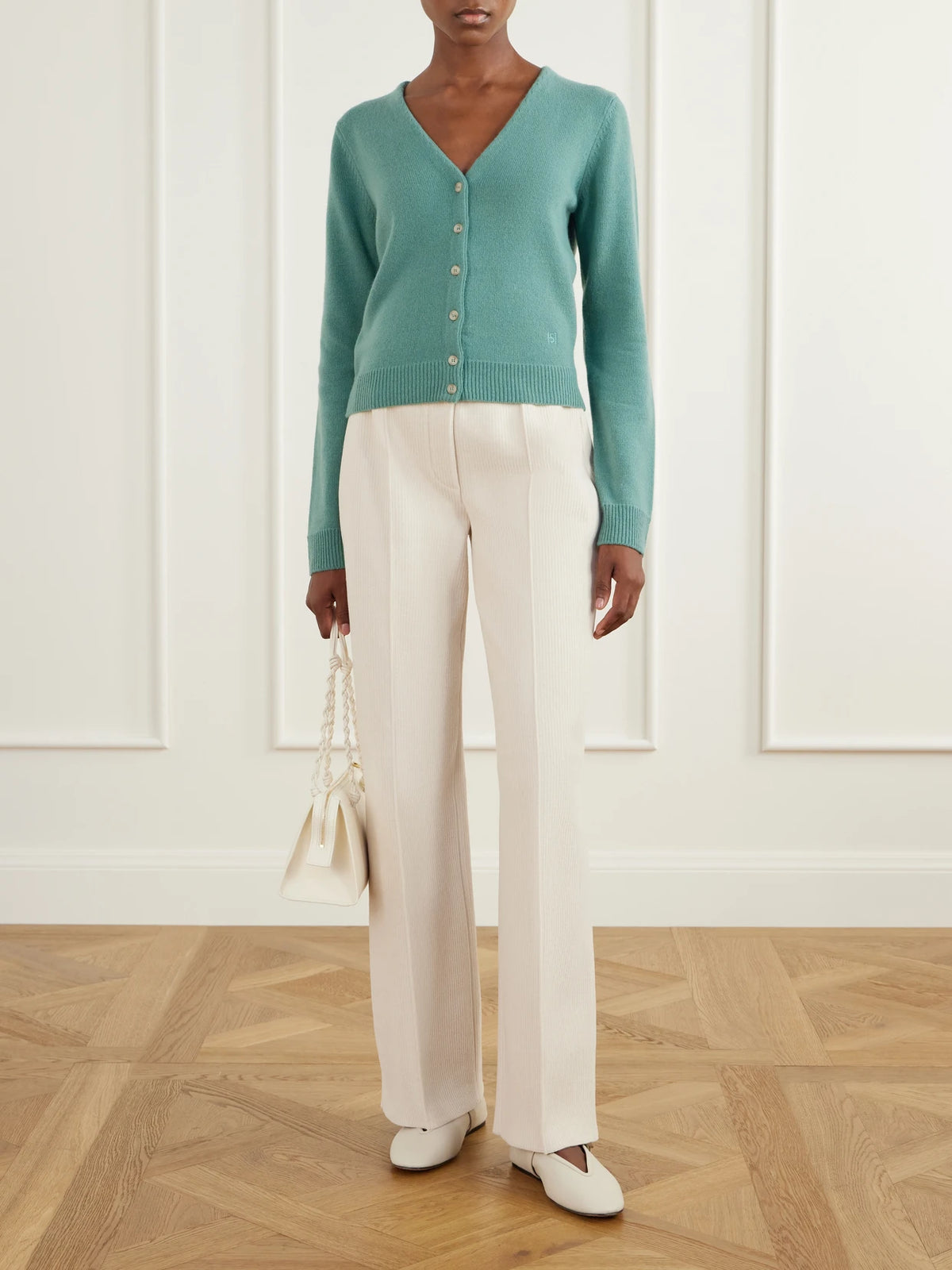 Image of a model wearing Outerwear. Product name - Cardi Wool And Cashmere-blend Cardigan in Sage green colour by brand - HIGH SPORT