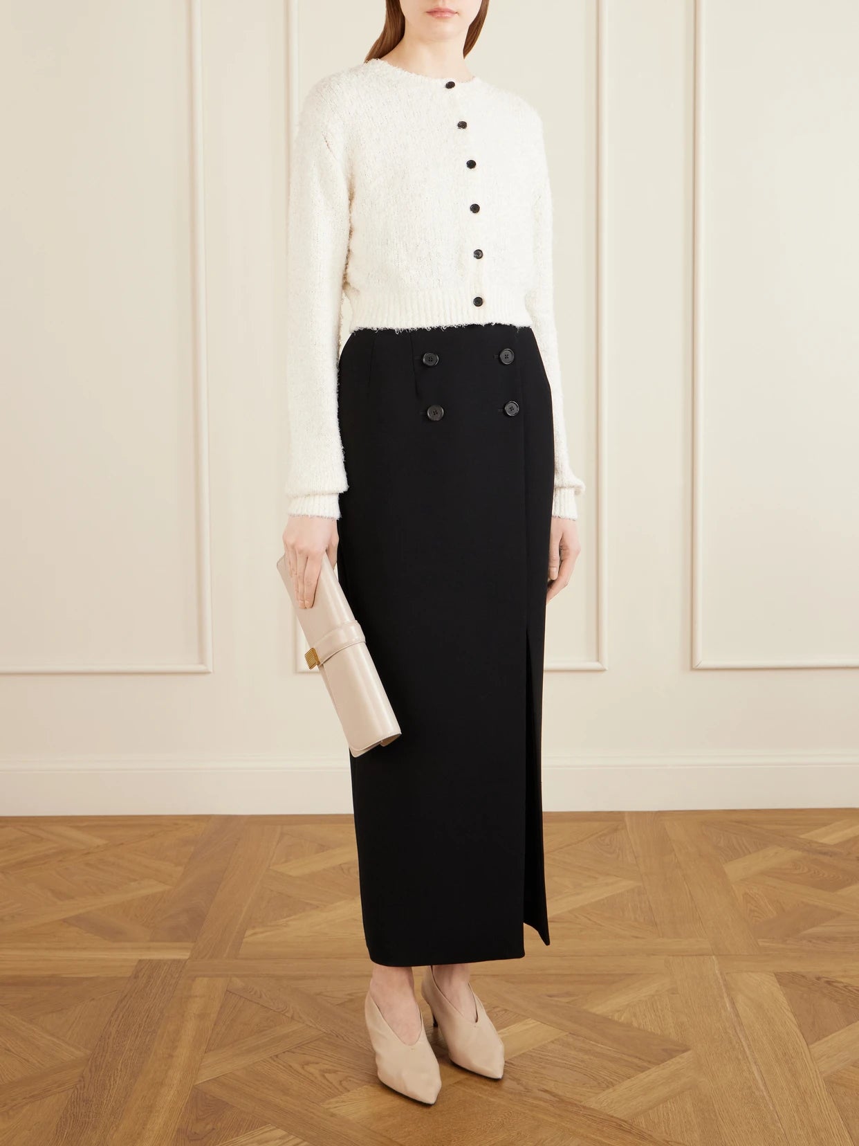 Image of a model wearing Outerwear. Product name - Paloma Linen-blend Cardigan in White colour by brand - KHAITE