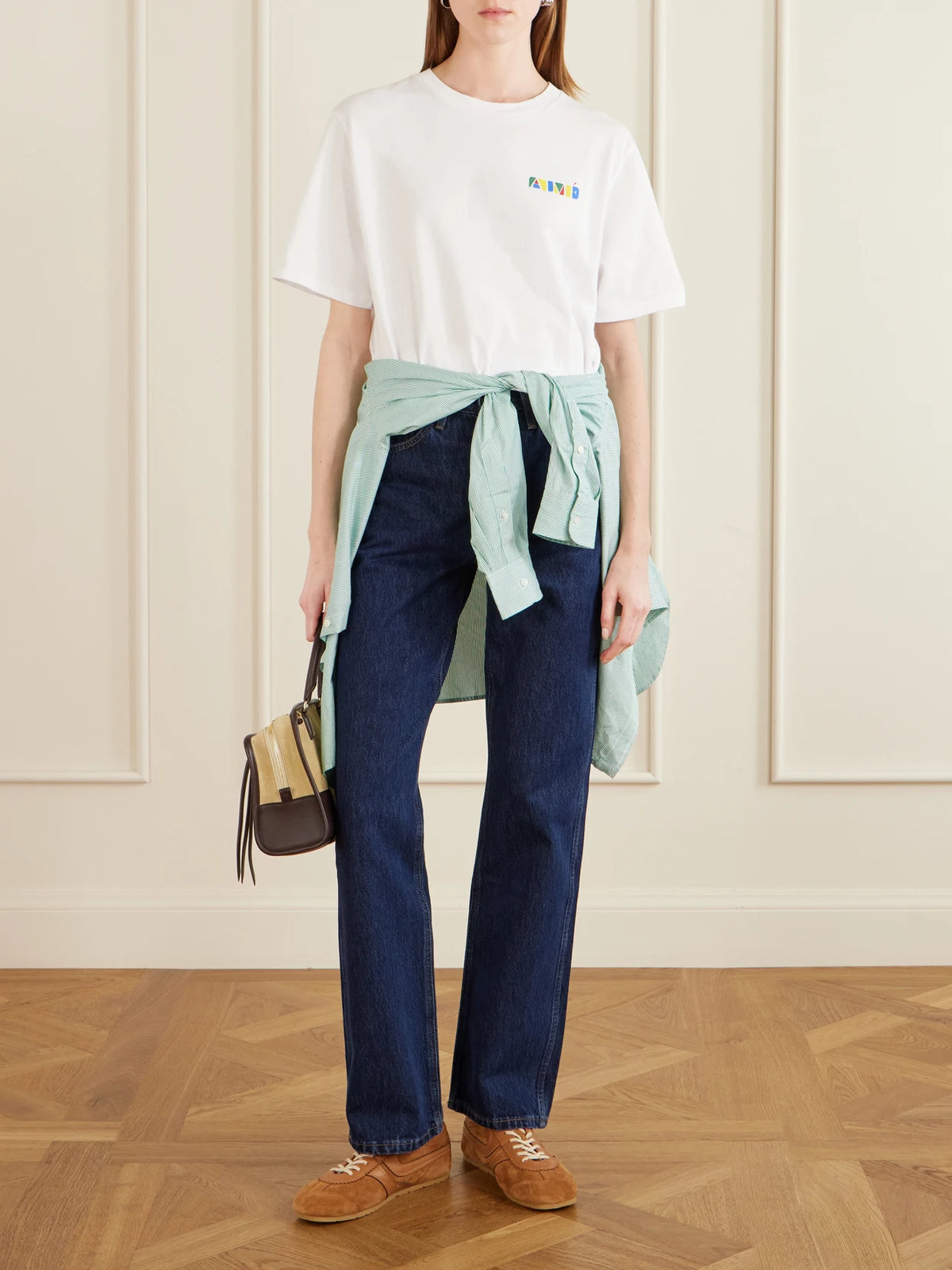 Image of a model wearing Tops. Product name - Printed Cotton-jersey T-shirt in White colour by brand - Aimé Leon Dore