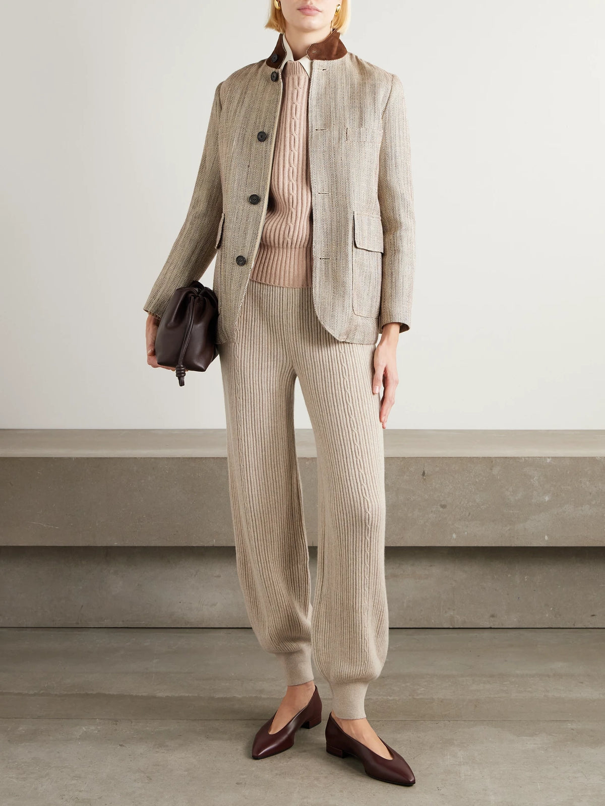 Image of a model wearing Outerwear. Product name - Plane Tree Ribbed Cashmere Sweater in Tan colour by brand - Loro Piana