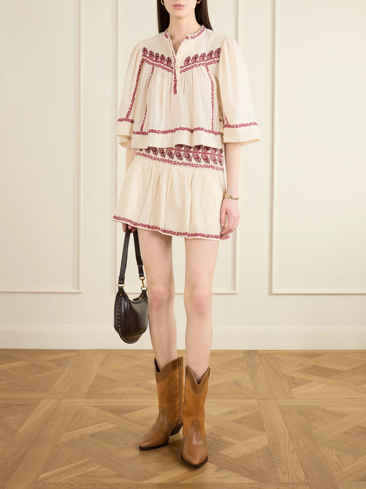 Image of a model wearing Skirts. Product name - Picadilia Embroidered Organic Cotton Mini Skirt in Beige colour by brand - MARANT ÉTOILE
