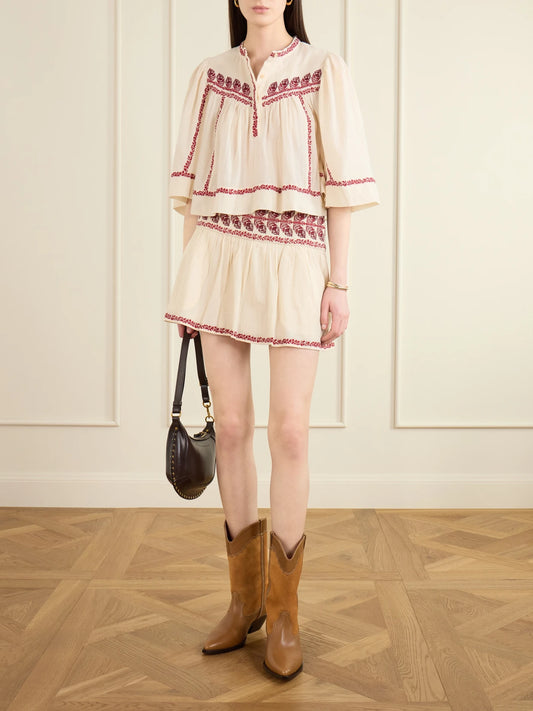Image of a model wearing Skirts. Product name - Picadilia Embroidered Organic Cotton Mini Skirt in Beige colour by brand - MARANT ÉTOILE