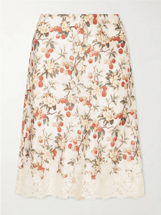 Image of a model wearing Skirts. Product name - Elowette Lace-trimmed Floral-print Silk-satin Midi Skirt in Multi colour by brand - DÔEN