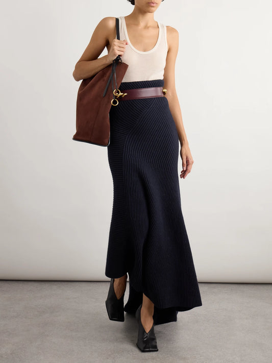 Image of a model wearing Skirts. Product name - Asymmetric Ribbed Wool And Cashmere-blend Skirt in Navy colour by brand - Alaïa