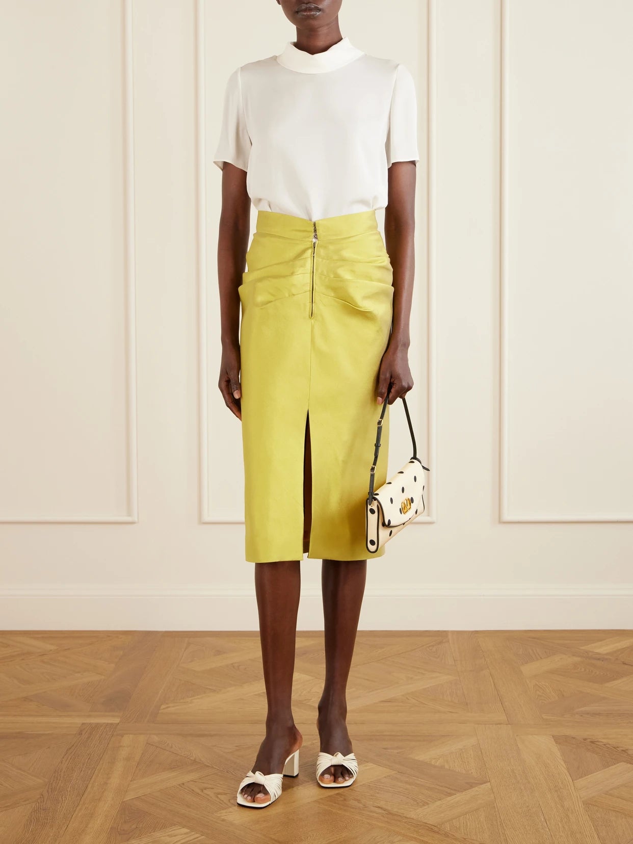 Image of a model wearing Skirts. Product name - Ruched Silk-shantung Midi Skirt in Yellow colour by brand - Valentino Garavani
