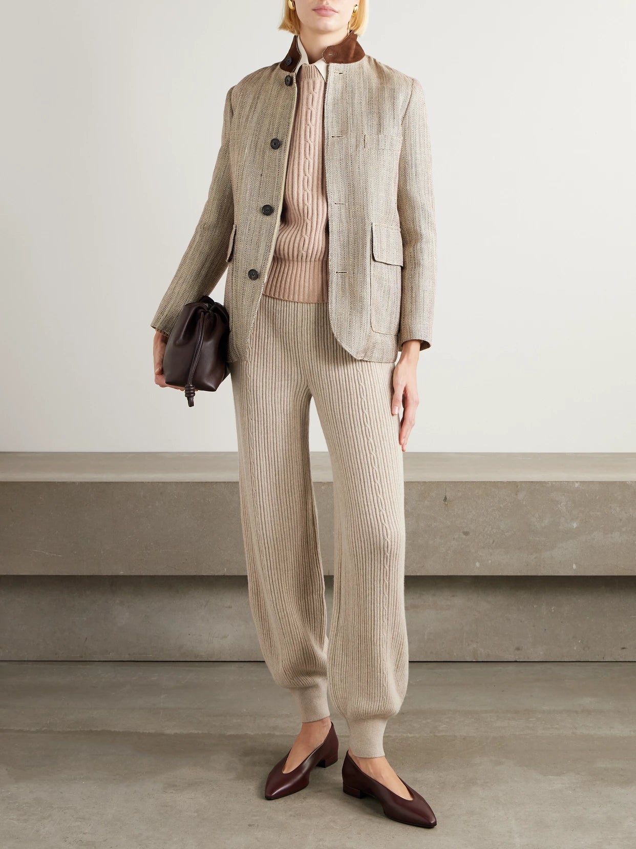 Image of a model wearing Pants. Product name - Plane Tree Ribbed Cashmere-blend Tapered Pants in Beige colour by brand - Loro Piana