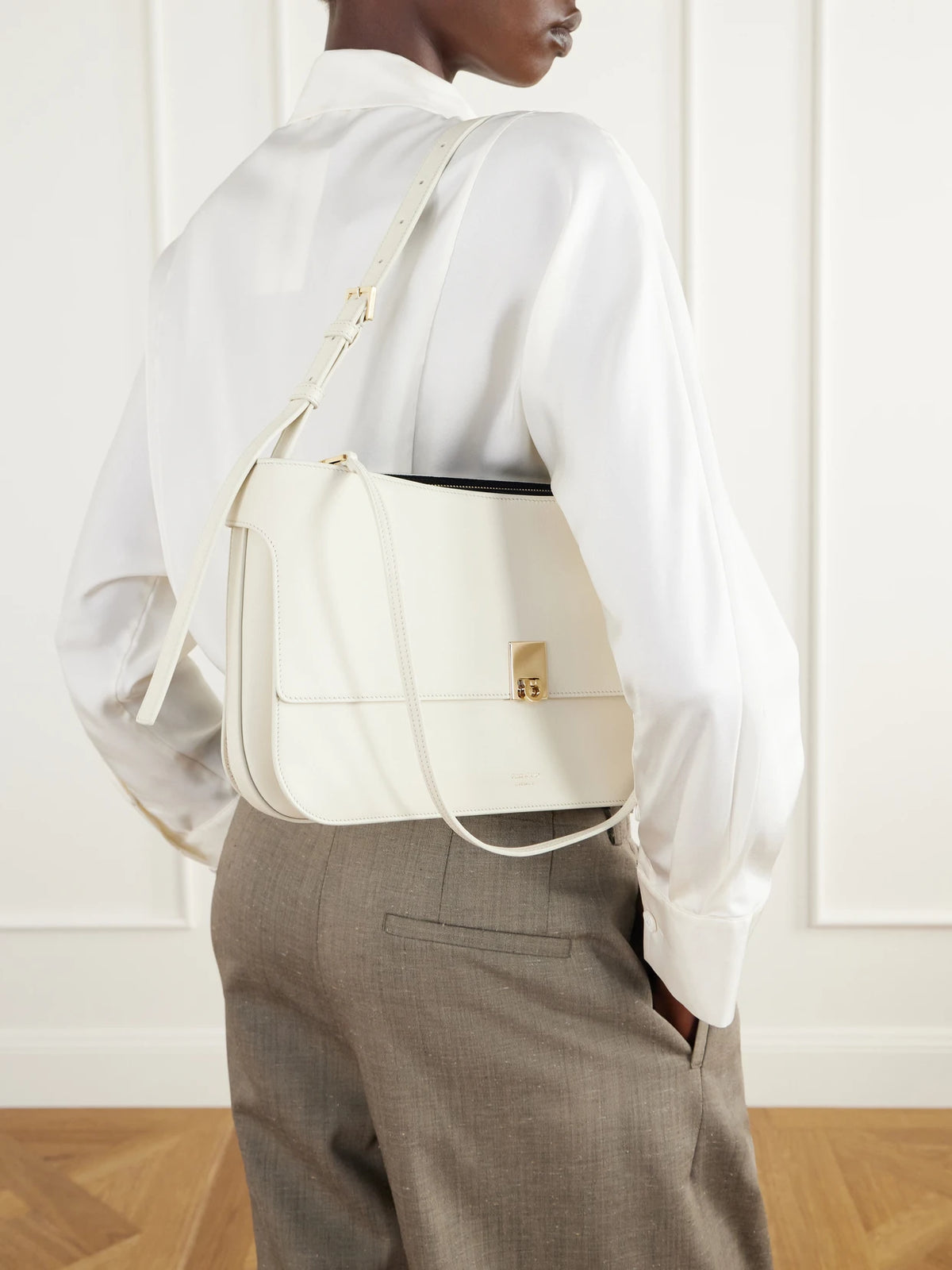 Image of Bags. Product name - Cara Suede-trimmed Leather Shoulder Bag in White colour by brand - Ferragamo