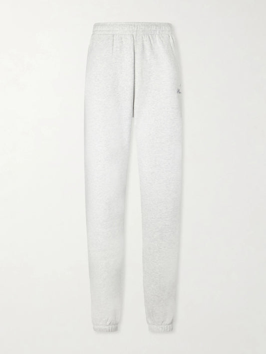 Image of a model wearing Tops. Product name - Beverly Script Cotton-jersey Track Pants in Gray colour by brand - Sporty & Rich