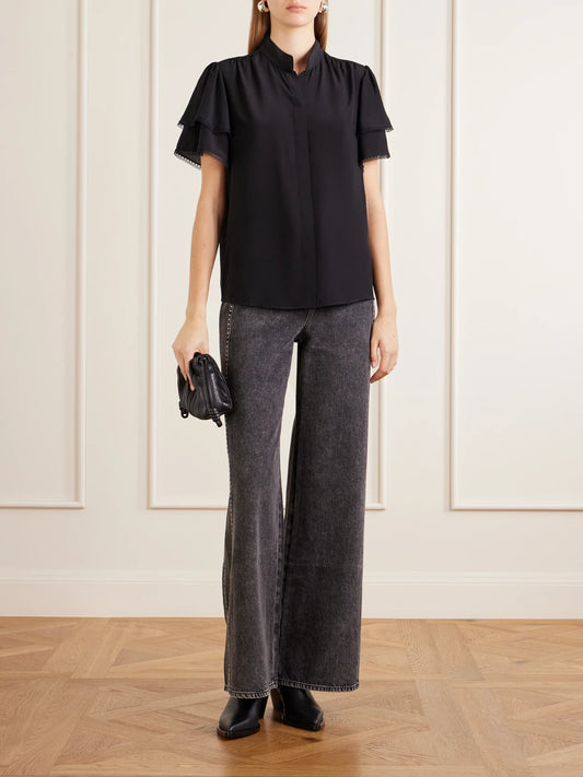 Image of a model wearing Tops. Product name - Arcadia Lace-trimmed Silk Blouse in Black colour by brand - FRAME