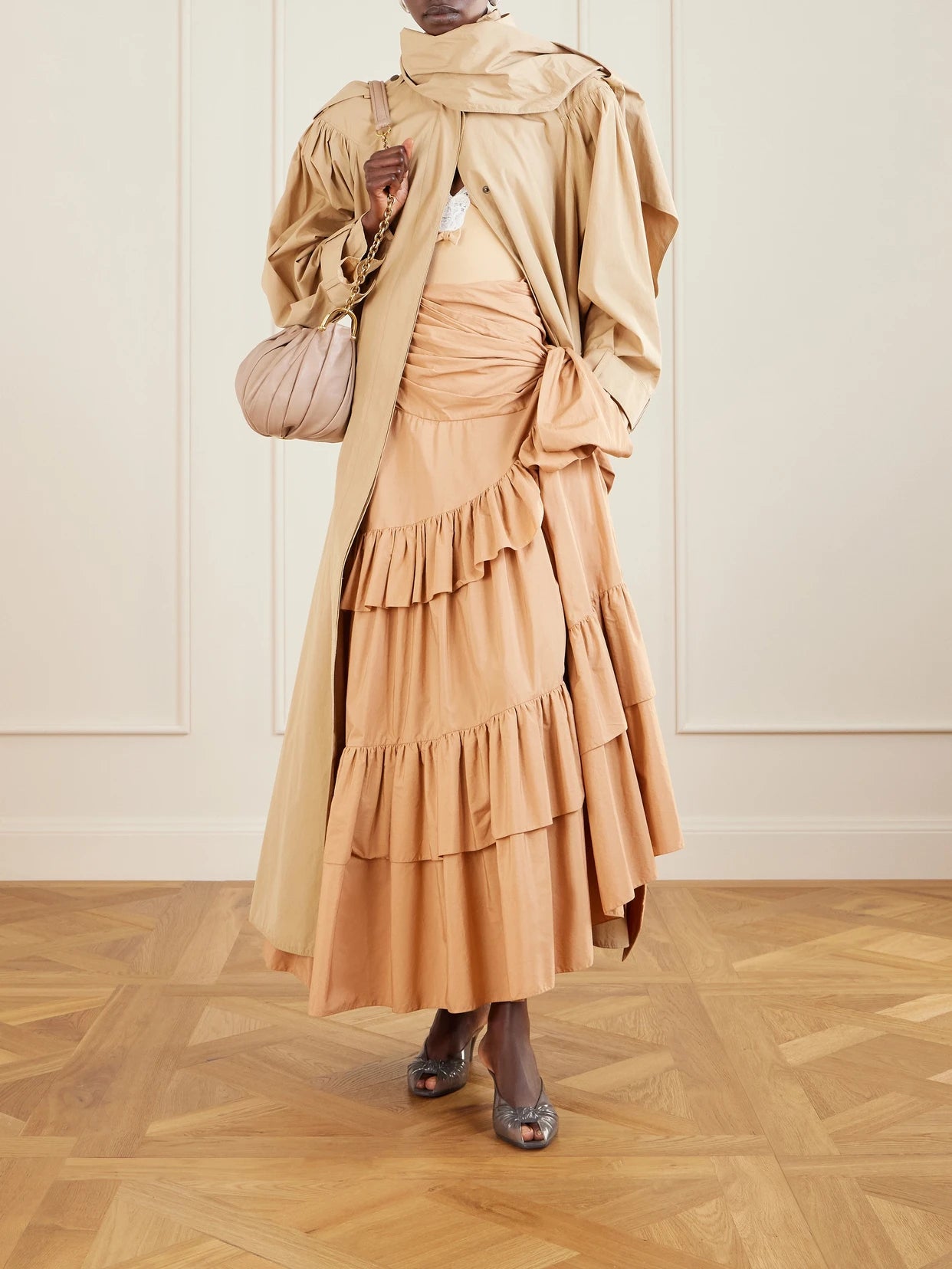 Image of a model wearing Tops. Product name - Bow-detailed Lace-trimmed Stretch-jersey Bodysuit in Beige colour by brand - Chloé