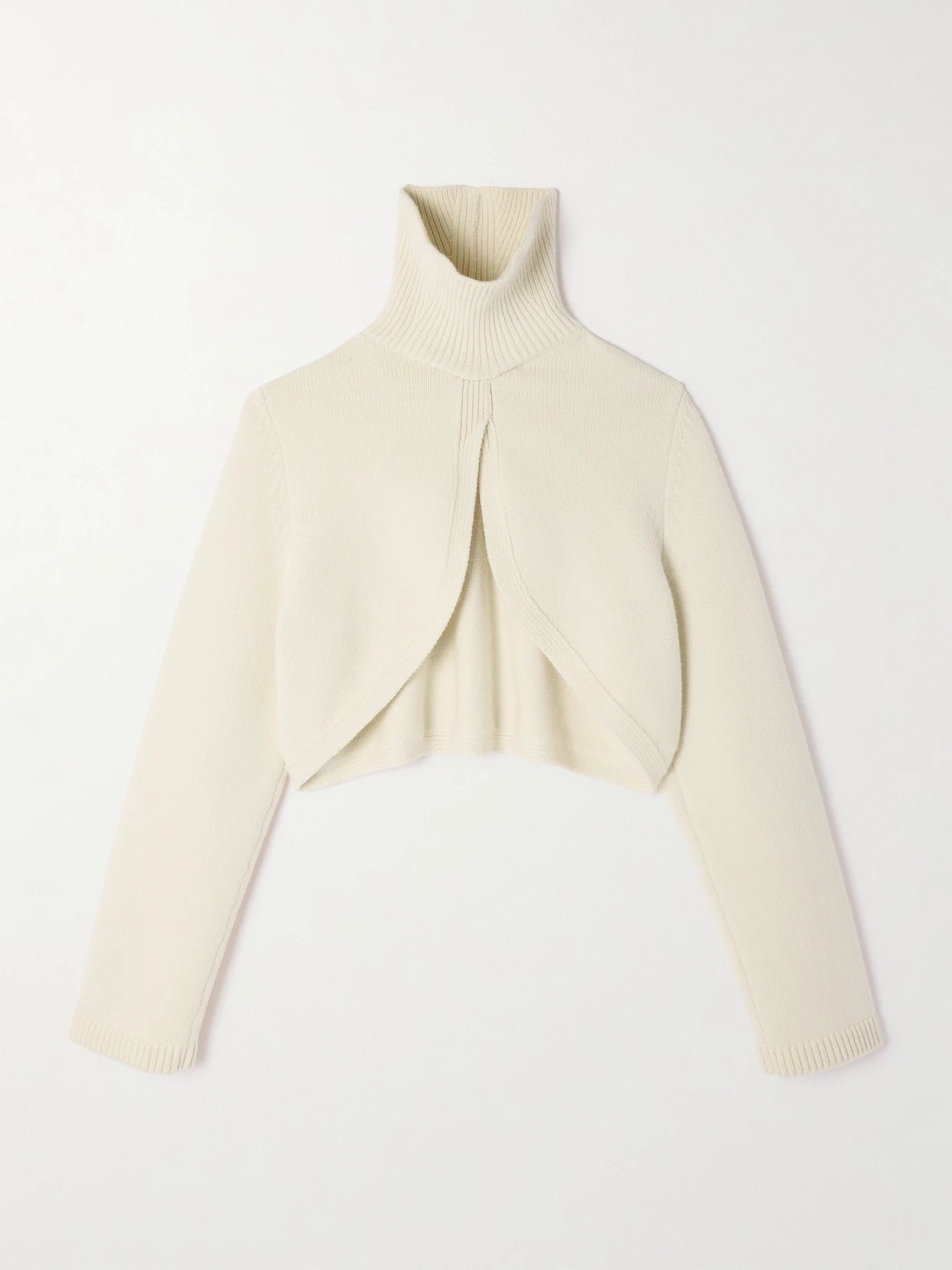 Image of a model wearing Outerwear. Product name - Cropped Cashmere-blend Turtleneck Sweater in Ivory colour by brand - Alaïa