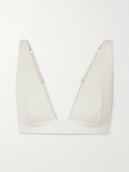 Image of Lingerie. Product name - Plunge Ribbed Cotton-blend Jersey Bralette - Bone in White colour by brand - SKIMS
