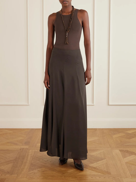 Image of a model wearing Skirts. Product name - Aeris Pleated Silk-crepe Midi Skirt in Dark brown colour by brand - Ruohan