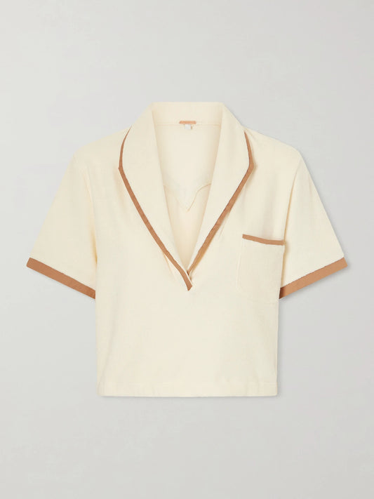 Image of a model wearing Tops. Product name - Terry Cropped Cotton-blend Terry Top in Cream colour by brand - Johanna Ortiz
