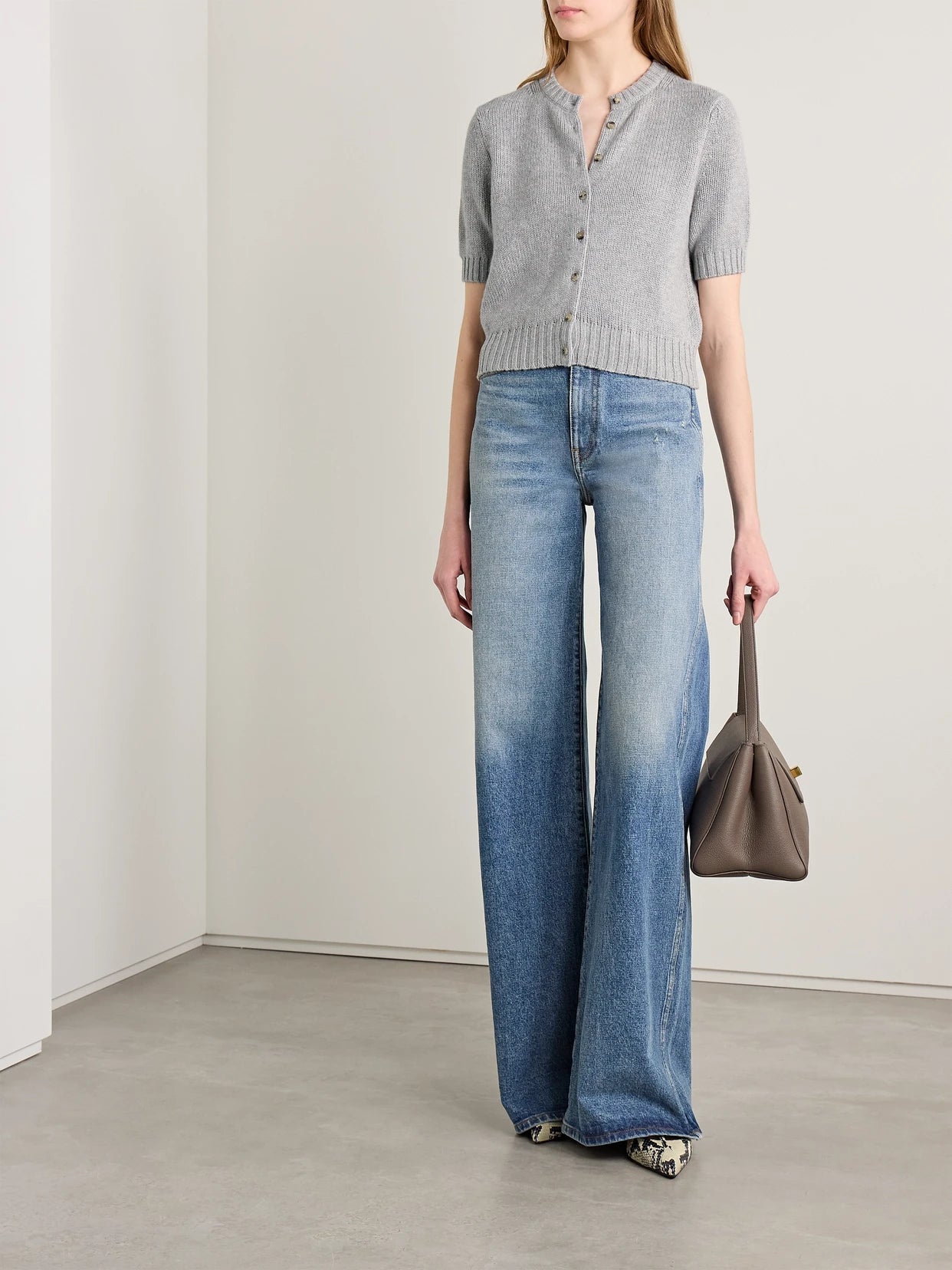 Image of a model wearing Outerwear. Product name - Nora Cropped Cashmere Cardigan in Gray colour by brand - KHAITE