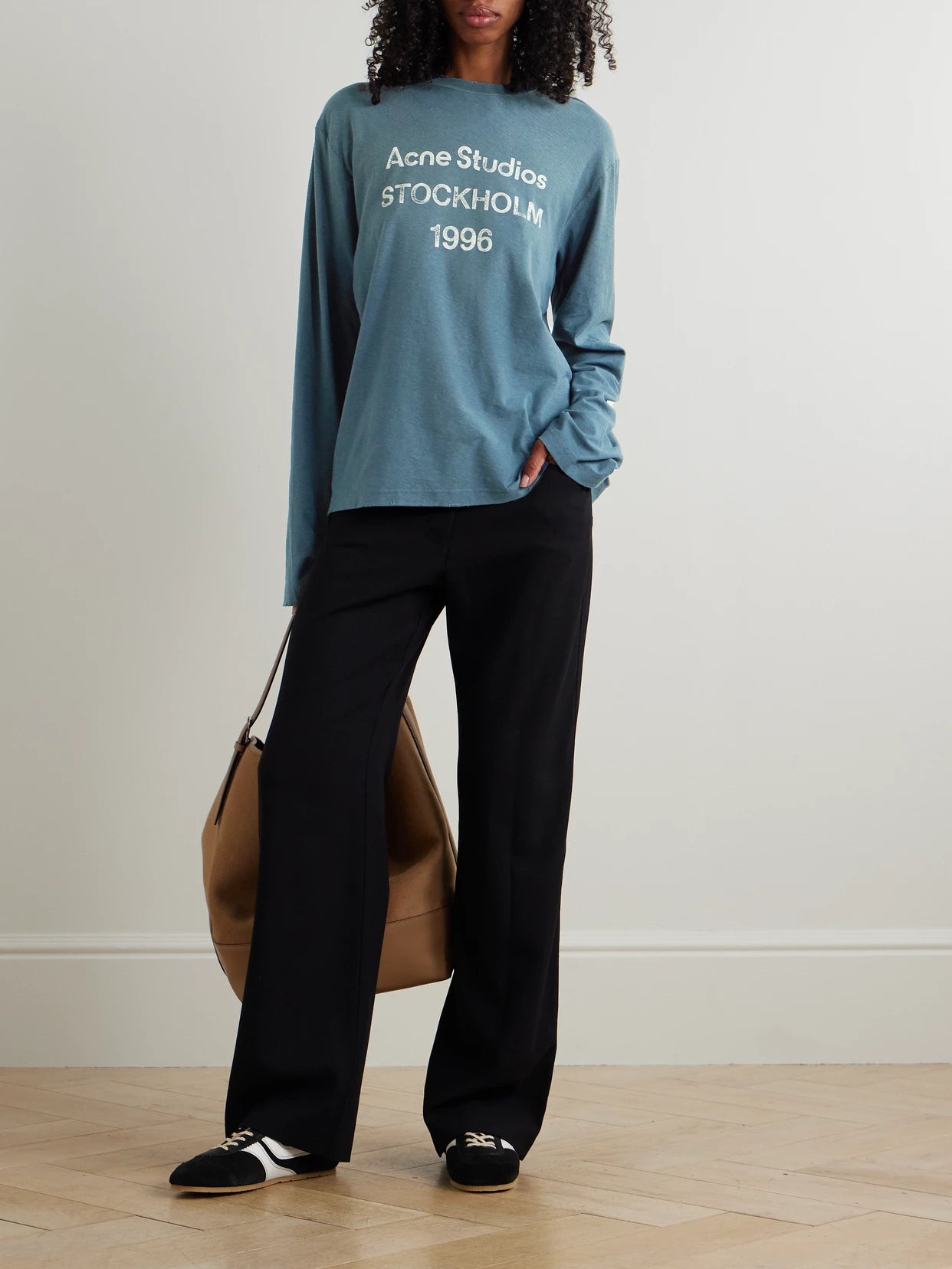 Image of a model wearing Tops. Product name - Printed Organic Cotton And Hemp-blend Jersey T-shirt in Navy colour by brand - Acne Studios