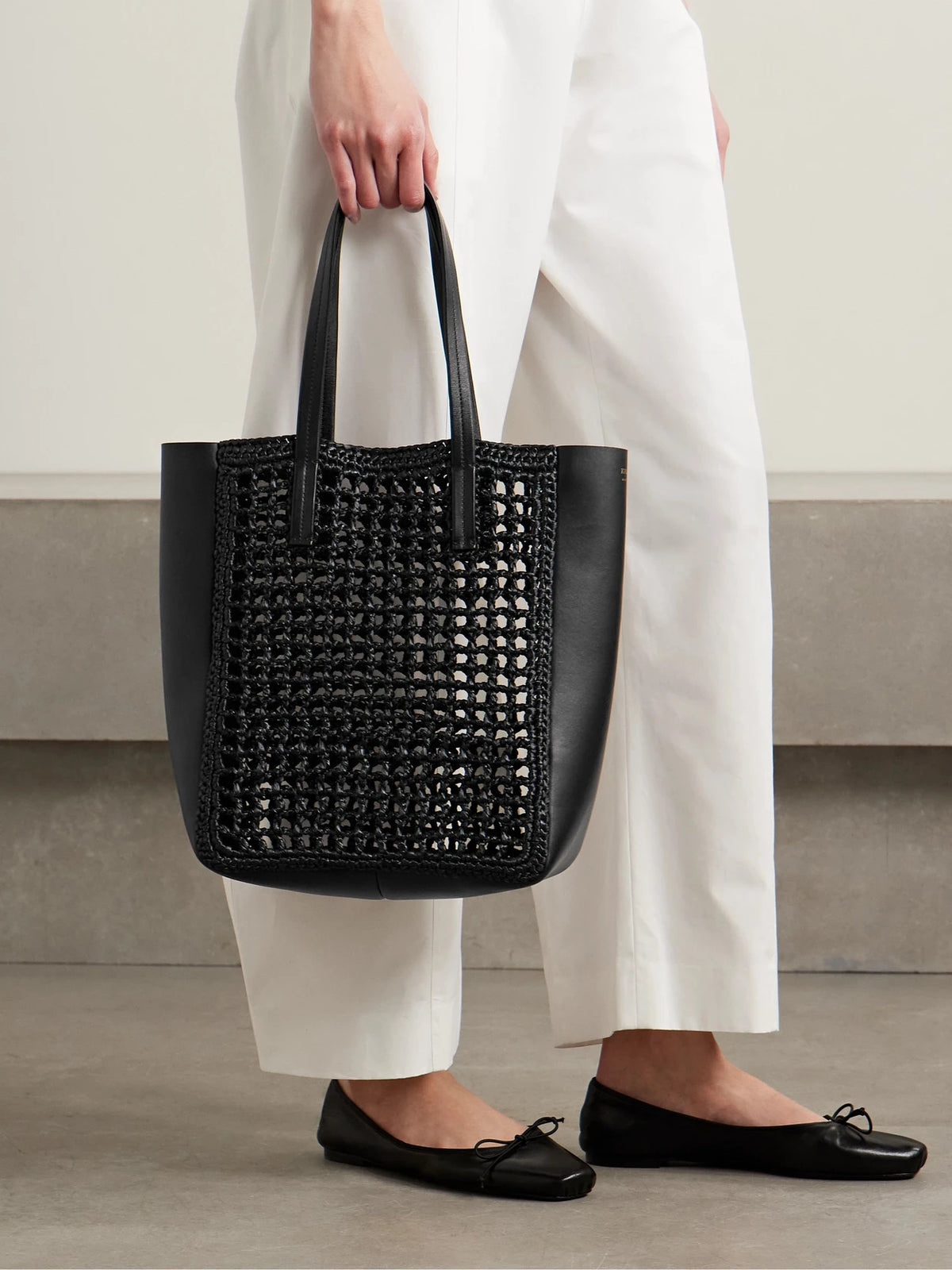 Image of Bags. Product name - Zoe Small Leather And Raffia Tote in Black colour by brand - KHAITE