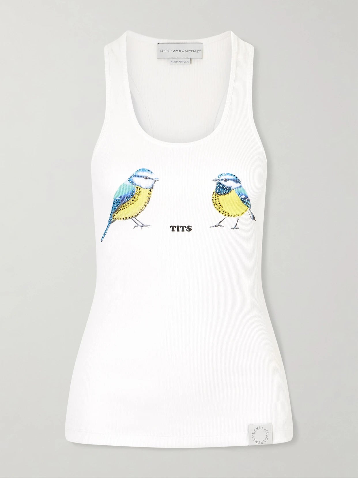 Image of a model wearing Tops. Product name - Hot Fix Crystal-embellished Printed Ribbed Stretch-cotton Tank in White colour by brand - Stella McCartney