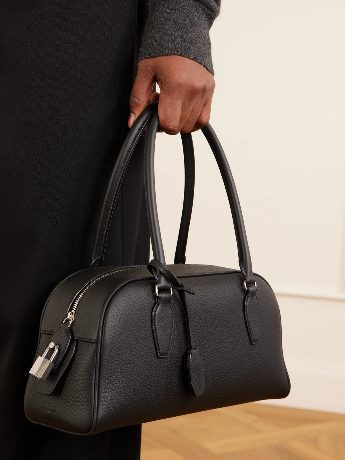 Image of Bags. Product name - India Small Textured-leather Tote in Black colour by brand - The Row
