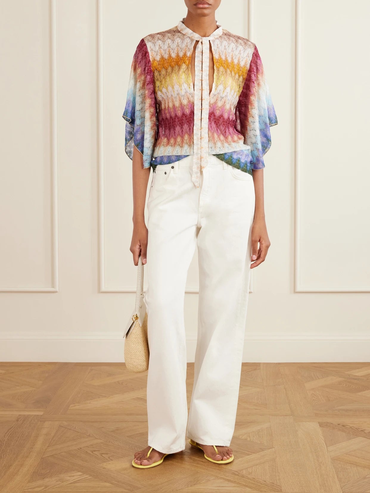 Image of a model wearing Tops. Product name - Tie-detailed Striped Crochet-knit Blouse in Blue colour by brand - Missoni